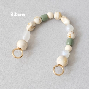 Bandoulière de sac 33cm en perles de résine crème et marbrée avec anneaux dorés