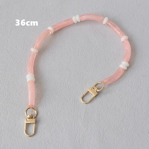 Detail of 36cm pink candy color acrylic bead strap with golden metal lobster clasps
