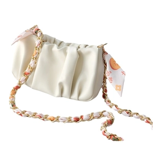 Cream pleated cloud bag with gold chain strap and printed floral scarf decoration
