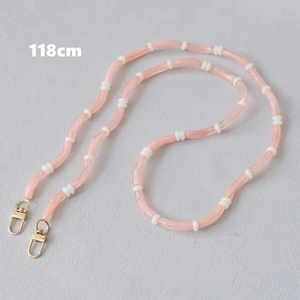 Detail view of pink and white acrylic bead chain with 118cm length and gold lobster clasps