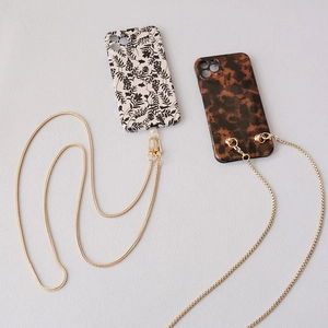 Floral and tortoiseshell phone cases with detachable long gold metal chain straps