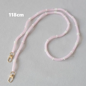 Detail view of 118cm pink acrylic bead chain with golden metal lobster clasps for bags