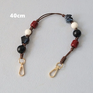 Detail of 40cm acrylic beaded strap with marble pattern beads and gold lobster clasps