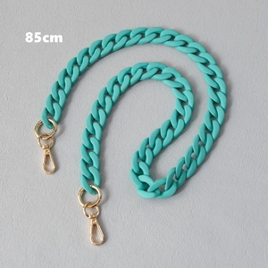 Detailed macro view of 85cm teal acrylic chain strap with gold metal lobster clasps
