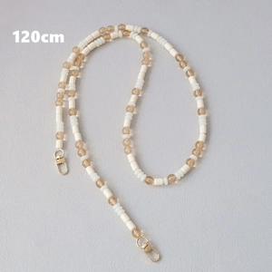Detail of 120cm acrylic beaded strap with brown beads and golden metal lobster clasps