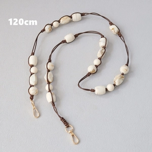 Detail of 120cm acrylic bead strap with marble texture and gold lobster clasps