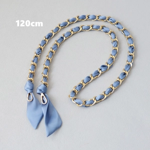 Detail of 120cm light blue silk ribbon interwoven with gold metal chain strap for handbags