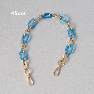 Detail of 45cm gold metal and sky blue acrylic link chain with spring lobster clasps