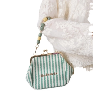 Retro green striped kiss-lock handbag with colorful beaded handle and embroidery