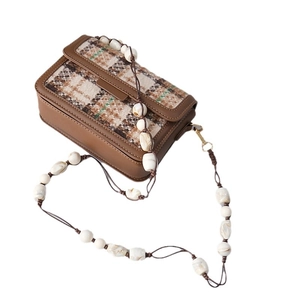 Crossbody tweed bag with brown leather trim and marble bead acrylic chain strap