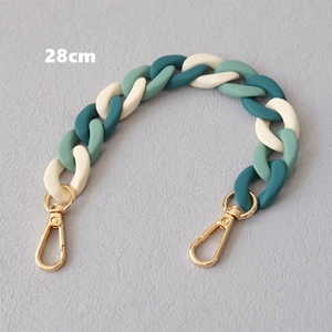 Detail view of a 28cm multi-color acrylic fishbone chain with golden lobster clasps