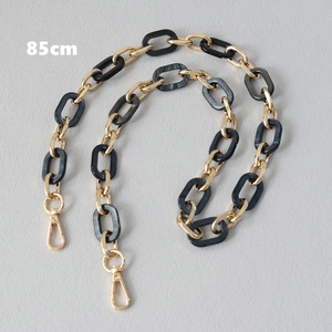 Detail of 85cm replacement bag strap with black marble resin rings and gold metal links