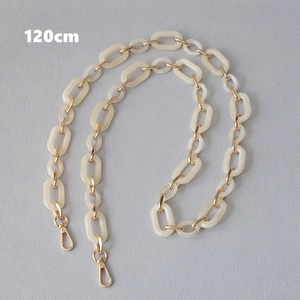 Detail of 120cm cream resin links and gold metal chain strap with lobster clasps