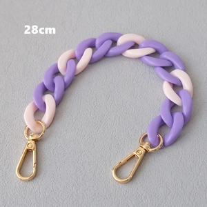 Detail view of 28cm purple and pink acrylic fishbone chain with golden lobster clasps