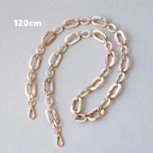 Detail view of a 120cm mixed acrylic marble and gold metal chain with lobster clasps