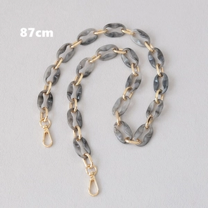 Detail view of 87cm marble grey acrylic chain with gold metal rings and lobster clasps