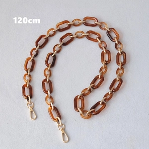 Detail view of 120cm amber resin and gold metal link chain strap with lobster clasps