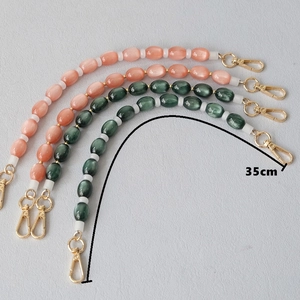 35cm cat eye resin short chain straps with gold lobster clasps in pink and dark green