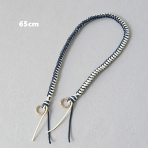 Detail view of 65cm navy and beige braided cord strap with gold metal ring buckles