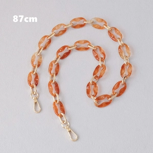 Detail of 87cm amber resin and gold metal link chain strap with lobster clasps