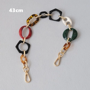 Detail of 43cm chunky resin chain strap with multi-color geometric links and gold clasps