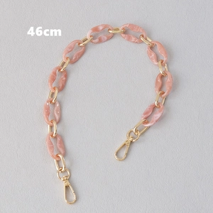 Macro view of 46cm pink marble resin bag chain with gold hardware and lobster clasps