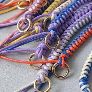 Detail of colorful braided bag chains with premium golden spring rings and spiral texture