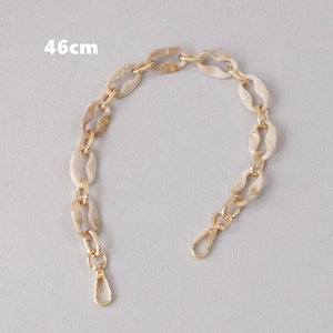 Detail view of 46cm acrylic shoulder strap with marble links and gold lobster clasps