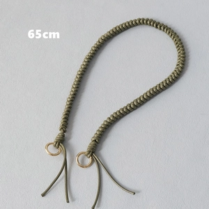 Detail view of army green 65cm braided cord handle with gold metal rings for handbags