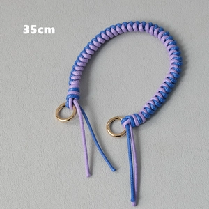 Detail of 35cm blue and purple woven bag handle strap with golden circular clasps
