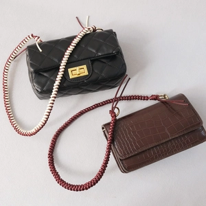 Quilted black and crocodile brown shoulder bags with woven rope chain straps