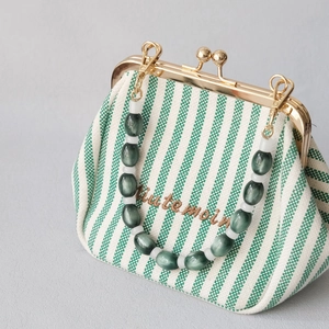 Green striped fabric purse with gold kiss-lock and vintage opal resin bead chain handle