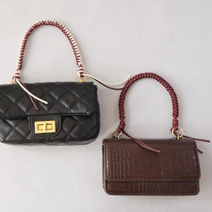 Mini handbags with woven wax rope handles in quilted black and crocodile brown textures