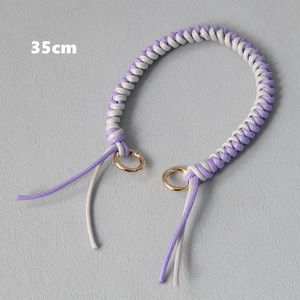 Detailed view of 35cm purple and white braided cord bag strap with gold metal rings