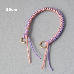 Detail view of 35cm bicolor woven wax rope handle with golden spring ring buckles