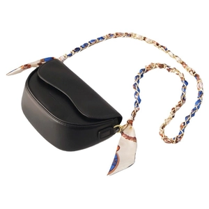 Elegant black saddle bag with vintage scarf-wrapped chain strap for luxury women fashion