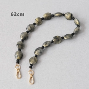 Detail view of 62cm marble acrylic bead chain with golden lobster clasps