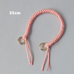 Pink woven bag handle strap with gold circular rings and 35cm length specification