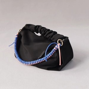 Fashionable black ruched cloud handbag with colorful braided rope handle and gold rings