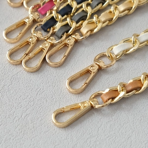 Detail of colorful leather woven gold metal chain straps for handbags with lobster clasps