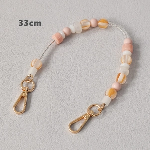 Detailed 33cm acrylic bead chain with pink and orange tones and gold lobster clasps