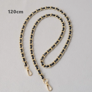 Close-up of a 120cm gold metal chain interwoven with black leather and lobster clasps