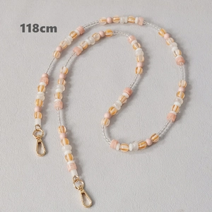 Detail view of 118cm colorful acrylic beaded strap with gold metal lobster clasps