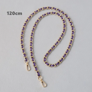 Detail view of a 120cm purple leather woven gold metal chain strap with lobster clasps