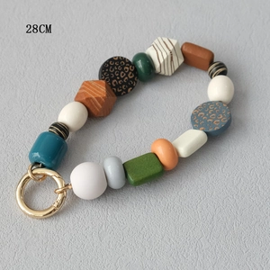 Detailed view of 28cm colorful acrylic beaded phone strap with gold metal ring clasp