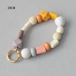 Close-up of 28cm colorful acrylic beaded phone strap with purple leopard print and gold clasp