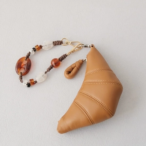 Brown leather croissant coin purse with colorful acrylic resin bead handle and metal clip