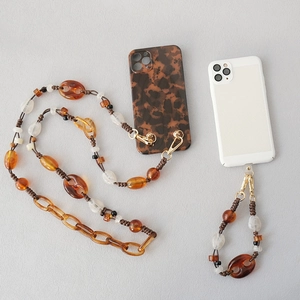Amber acrylic bead strap for phone case with gold metal clips and woven cord