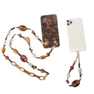 Amber acrylic bead phone strap set with golden clips and tortoise pattern cases