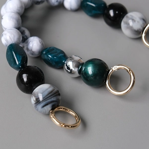Handmade beaded bag chain with marble resin beads and a gold spring ring clasp